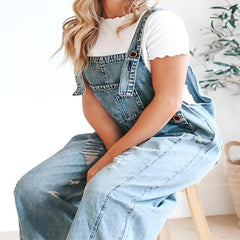 Loose fit distressed denim jumpsuit